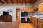 Cozy kitchen with wood finishes and double ovens